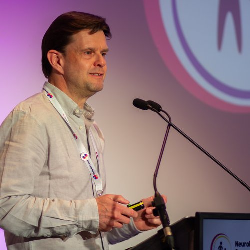 Research advocate and SKC UK Chair of Trustees, Nick Bird, presenting at a neuroblastoma conference.