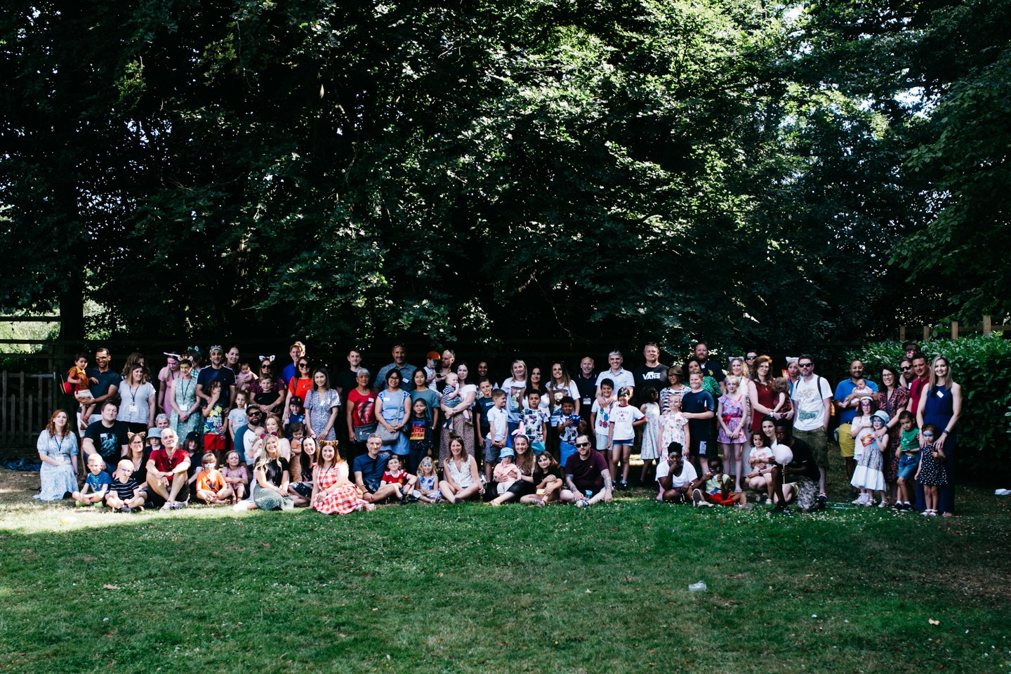 A group photo of Solving Kids' Cancer UK staff and families affected by neuroblastoma at the Family Fun Day in 2022.