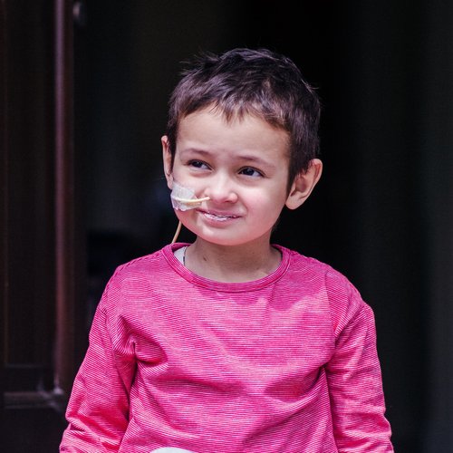 Liam sat down wearing a bright pink top during treatment
